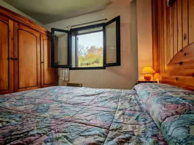 Cama o camas de una habitación en Chimenea, terraza y parking- Tu refugio acogedor - Besiberri 3