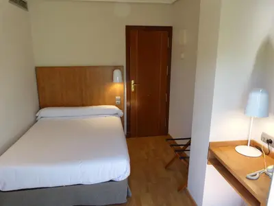 Cama o camas de una habitación en Hotel Avenida
