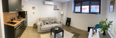 Una televisión o centro de entretenimiento en Apartamentos Abadía.