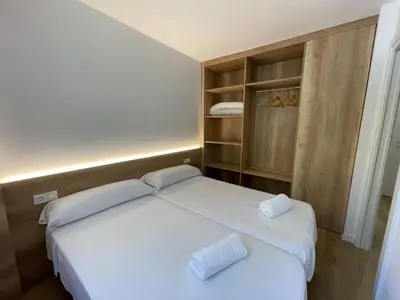 Cama o camas de una habitación en Apartamentos La Solana