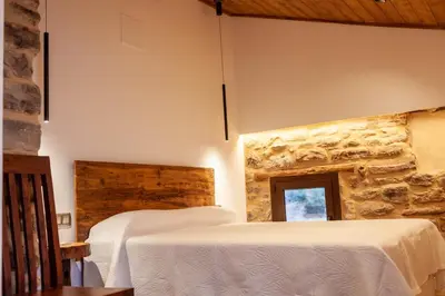 Cama o camas de una habitación en Casa Sanui. Apartaments turístics rurals
