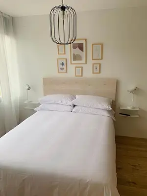 Cama o camas de una habitación en SAN LORENZO HUESCA con parking