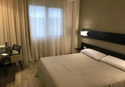 Cama o camas de una habitación en Blu Hotel Pamplona