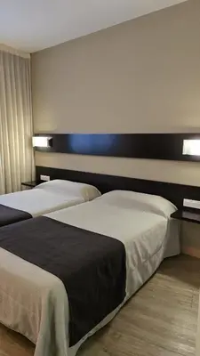 Cama o camas de una habitación en Blu Hotel Pamplona