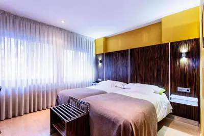 Cama o camas de una habitación en Hotel Gran Via
