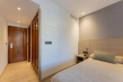 Cama o camas de una habitación en Hotel Casanova