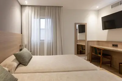 Cama o camas de una habitación en Hotel Casanova