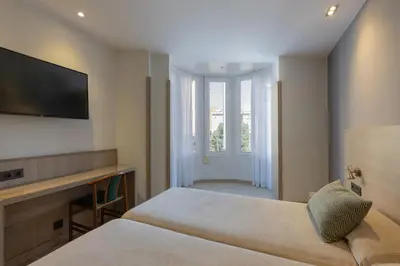 Cama o camas de una habitación en Hotel Casanova