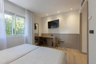 Cama o camas de una habitación en Hotel Casanova