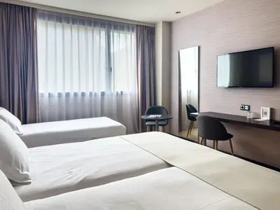 Cama o camas de una habitación en Abba Huesca