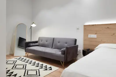 Cama o camas de una habitación en Hotel Iriguibel Huarte Pamplona