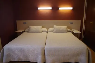 Cama o camas de una habitación en Hotel Alaiz
