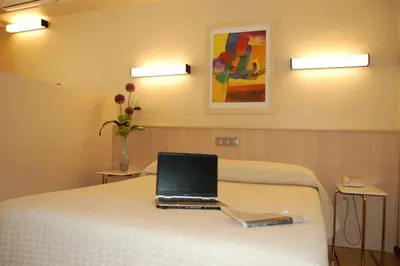 Cama o camas de una habitación en Hotel Alaiz