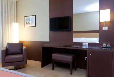 Una televisión o centro de entretenimiento en Hotel Ciudad de Alcañiz