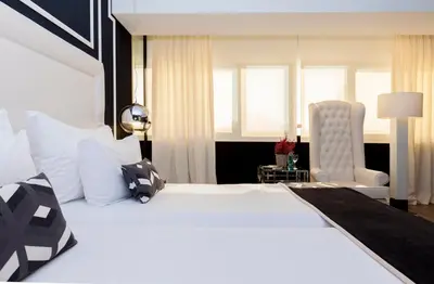 Cama o camas de una habitación en Hotel Tres Reyes Pamplona