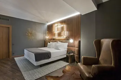 Cama o camas de una habitación en Hotel Tres Reyes Pamplona