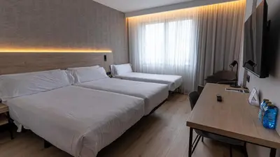 Cama o camas de una habitación en Hotel Blanca de Navarra