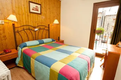 Cama o camas de una habitación en Hotel Llibrada