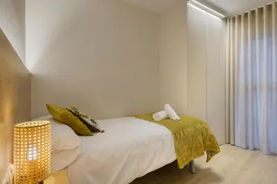 Cama o camas de una habitación en Apartamentos La muralla de Jaca