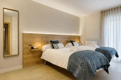 Cama o camas de una habitación en Apartamentos La muralla de Jaca