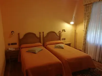 Cama o camas de una habitación en Hotel Xabier