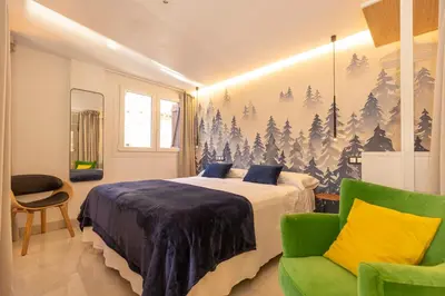 Cama o camas de una habitación en BALCON DE BENASQUE Losa Radiante Cama King Alta Gama Parking Opcional