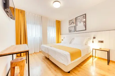 Cama o camas de una habitación en Hotel Viella