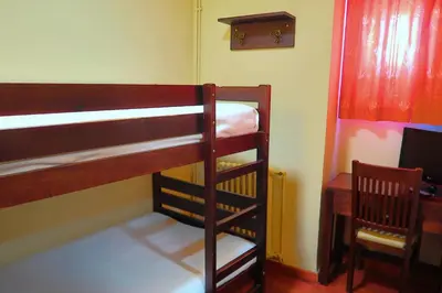 Cama o camas de una habitación en Hotel Urogallo