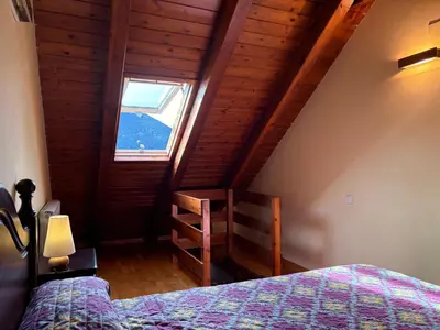 Cama o camas de una habitación en Triplex rústico, chimenea, esquí y vistas magníficas - Erta 4