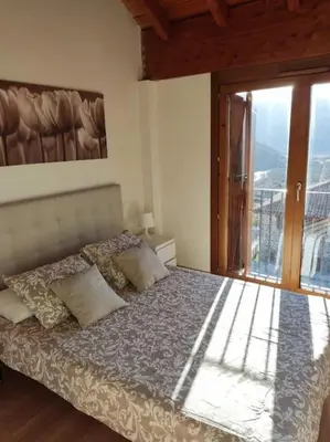 Cama o camas de una habitación en Casa Balcón de Los Pirineos - Gavín Biescas