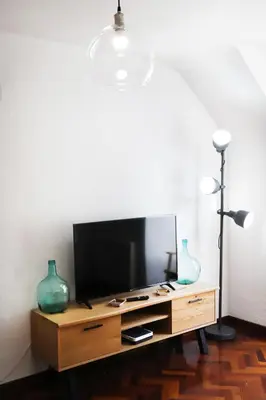 Una televisión o centro de entretenimiento en Apartamento La Campa