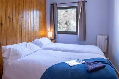 Cama o camas de una habitación en Tebarray ☆ Increíbles vistas, terraza y garaje · Pirineos360