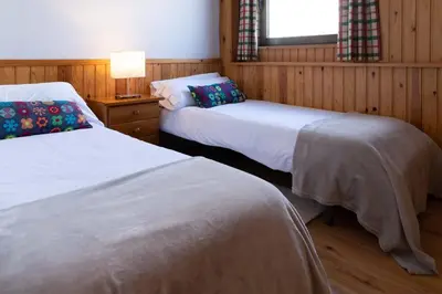 Cama o camas de una habitación en Tebarray ☆ Increíbles vistas, terraza y garaje · Pirineos360