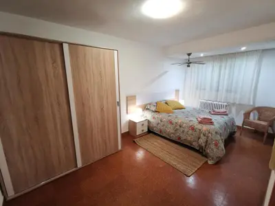 Cama o camas de una habitación en Cómoda vivienda en Huesca