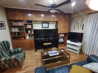 Una televisión o centro de entretenimiento en Cómoda vivienda en Huesca