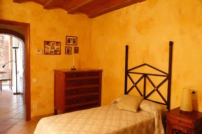 Cama o camas de una habitación en Ca l'Esteve