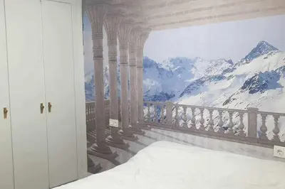 Cama o camas de una habitación en Acogedor apartamento en el Pirineo aragonés.