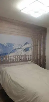 Cama o camas de una habitación en Acogedor apartamento en el Pirineo aragonés.