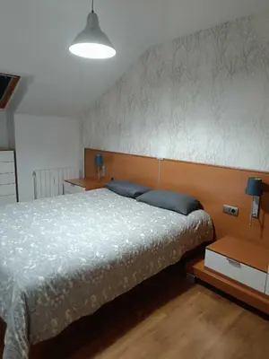 Cama o camas de una habitación en Precioso atico con bonitas vistas a la Peña Oroel