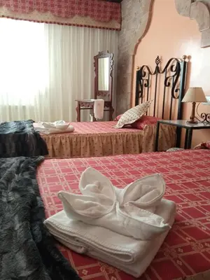 Cama o camas de una habitación en apartamentos en Castellote el batan