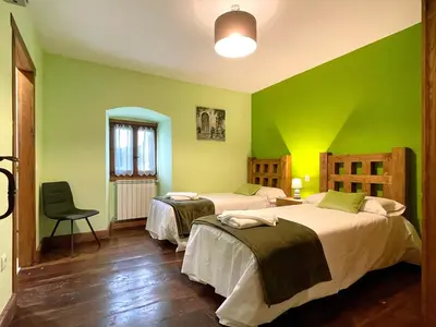 Cama o camas de una habitación en CASA RURAL ERVITENA