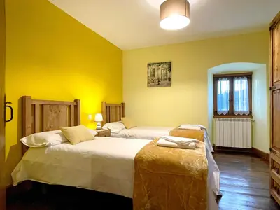 Cama o camas de una habitación en CASA RURAL ERVITENA