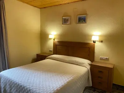 Cama o camas de una habitación en Hotel Rural Cal Amadeu