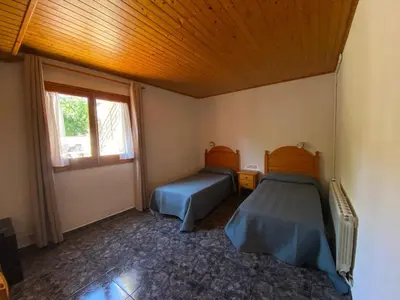 Cama o camas de una habitación en Hotel Rural Cal Amadeu