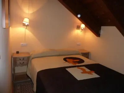 Cama o camas de una habitación en La buhardilla de Mayte