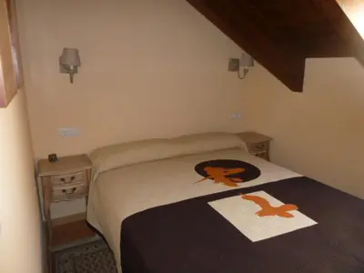 Cama o camas de una habitación en La buhardilla de Mayte
