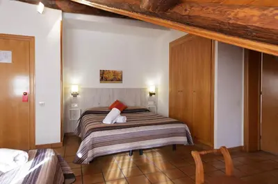 Cama o camas de una habitación en HOTEL LAMOGA