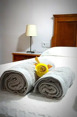 Cama o camas de una habitación en Apartaments rurals CAL PARRO, Batea (Terra Alta)