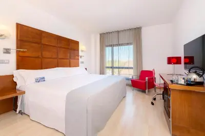 Cama o camas de una habitación en Hotel Zentral Ave