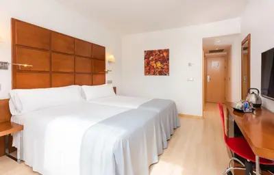 Cama o camas de una habitación en Hotel Zentral Ave